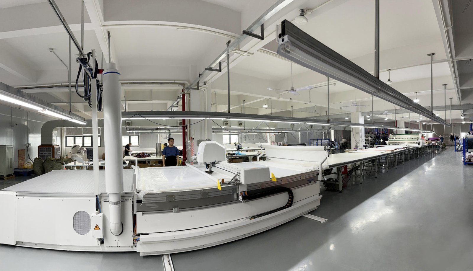 JuHong SPORTS 12 high-efficiency production lines with smart hanging system for sportswear manufacturing
