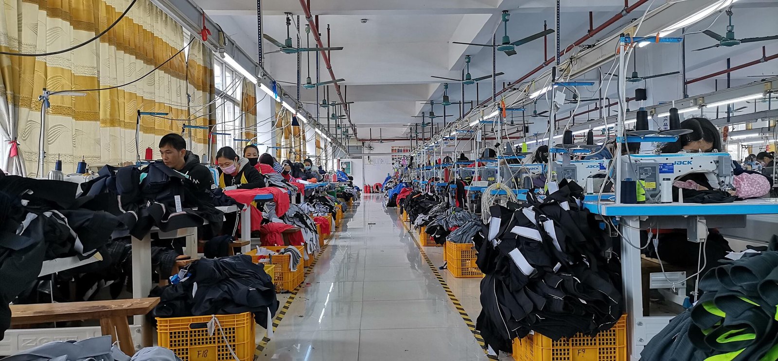 JuHong Sports skilled workers assembling high-performance sports apparel in Nanning factory